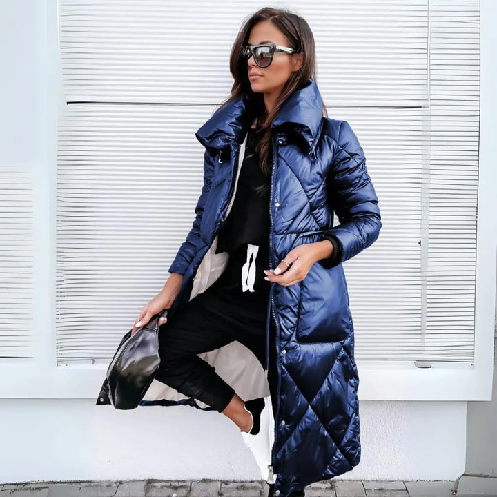 Stylish women's quilted long puffer coat. Stay warm and fashionable this winter with padded outerwear.