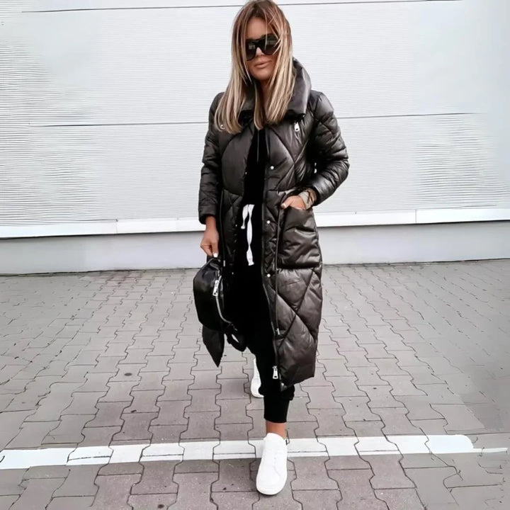 Women's padded long trench coat with a quilted design, offering warmth and style as winter outerwear.