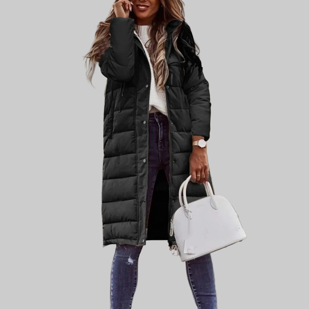 Women's long quilted hooded winter jacket. Warm, insulated outerwear for cold weather, stylish ladies' fashion coat.