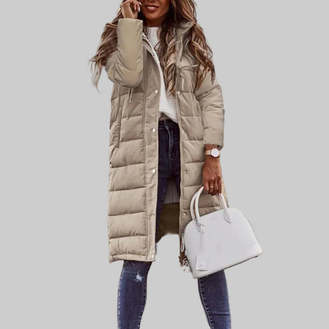 Ladies' casual quilted long hooded winter jacket. Fashionable, warm outerwear for cold weather, essential for winter.