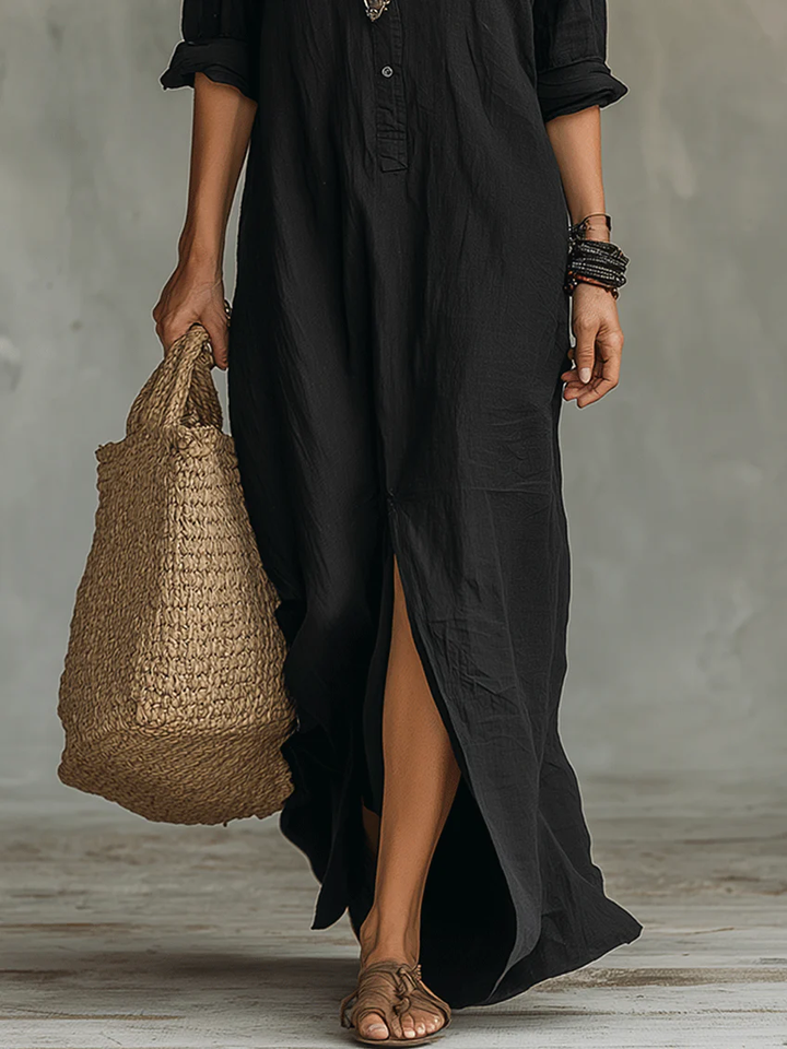 Woman wearing a stylish long-sleeve button-front shirt dress, perfect for casual or office elegance.