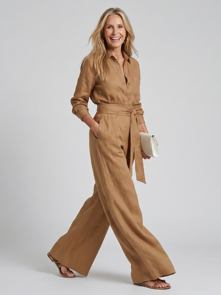 Front view of a women's long sleeve wide leg jumpsuit with full button front closure. Elegant & modern.