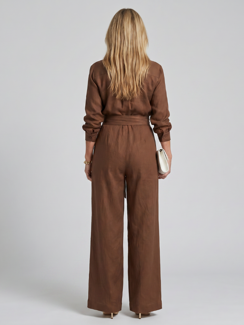 Versatile women's button-front wide leg jumpsuit. Long sleeves offer an elegant touch for various occasions.