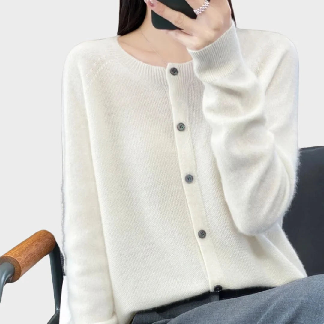 Soft knit women's long-sleeve cardigan sweater. Crew neck and full button front. A versatile layering piece.