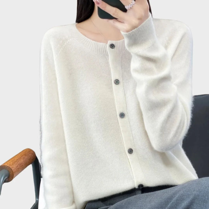 Soft knit women's long-sleeve cardigan sweater. Crew neck and full button front. A versatile layering piece.