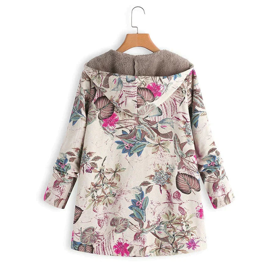 Full-length view of a women's long spring jacket, hooded, with visible pockets. Lightweight & casual outerwear.