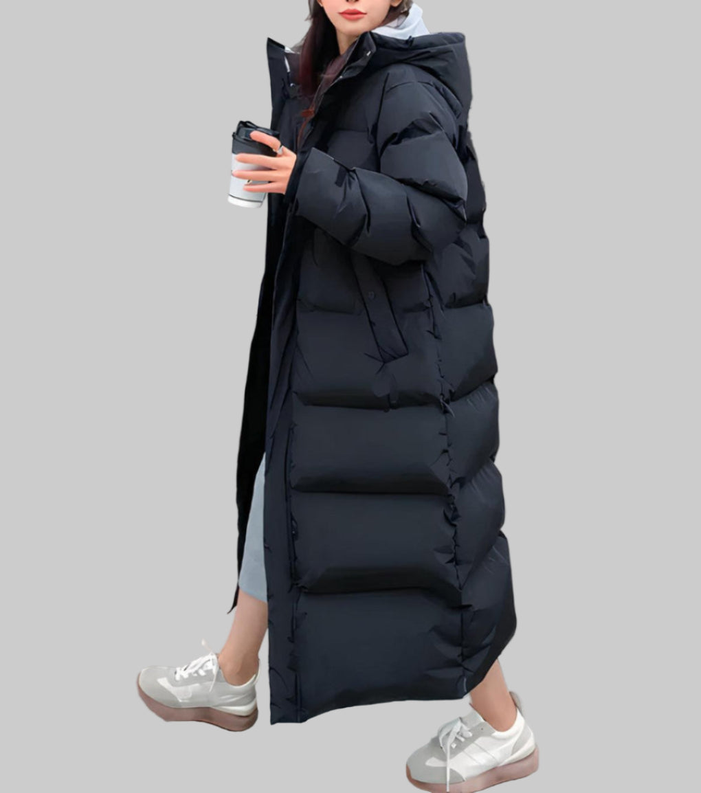 Women's long winter parka, waterproof & windproof, ideal for cold weather. Stylish outerwear and rain jacket.