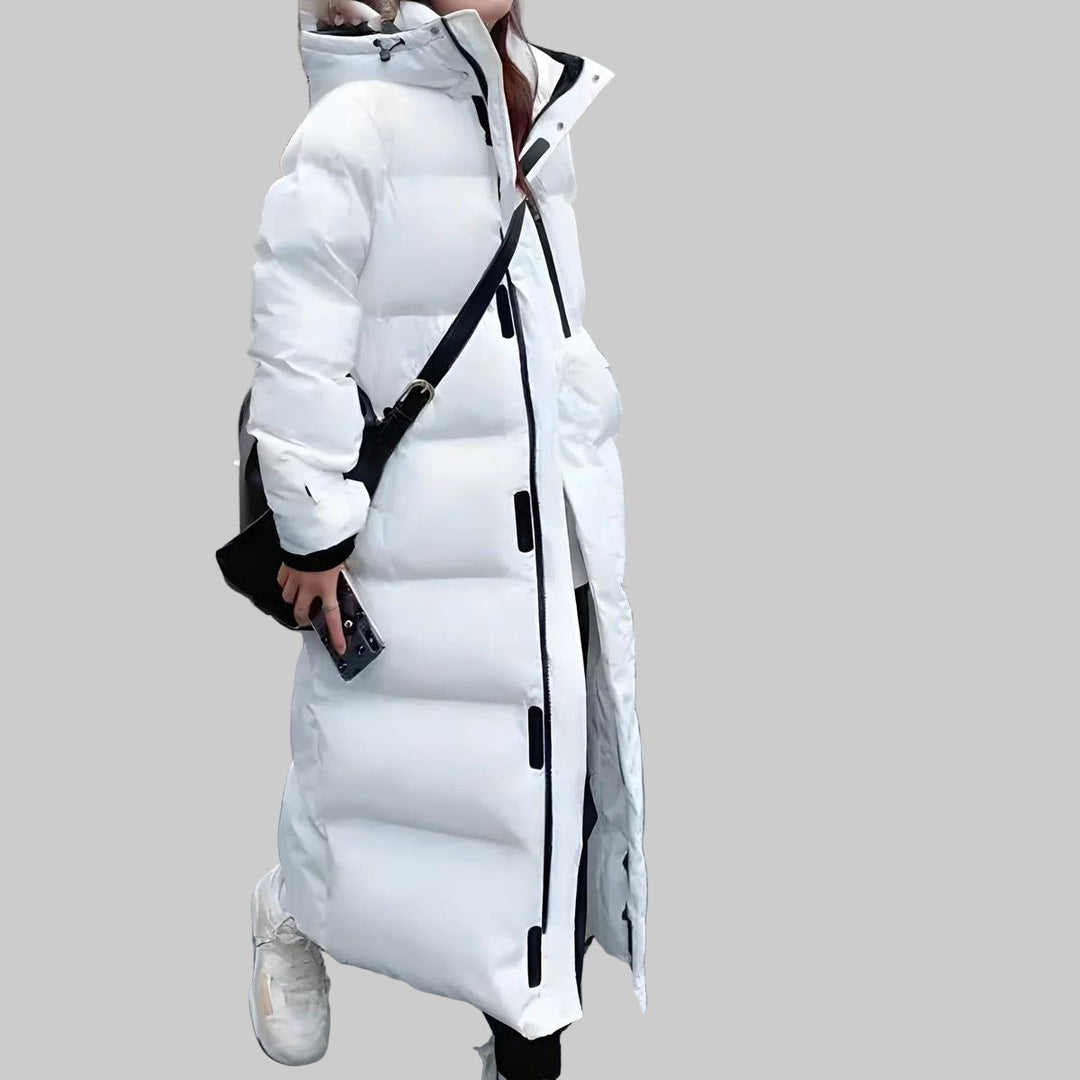 Fashionable women's long parka, windproof & waterproof winter coat. Essential outerwear for cold and rainy days.