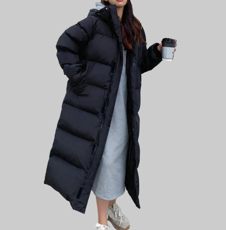 Durable women's long winter parka, designed to be waterproof & windproof. Perfect cold weather outerwear.