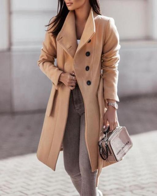 Women's longline double-breasted winter coat with waist tie for elegant cold weather fashion.