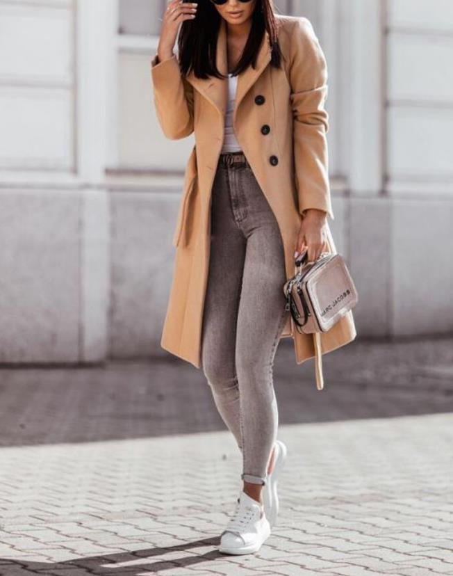 Fashionable women's longline double-breasted coat with a flattering waist tie, ideal for winter style.