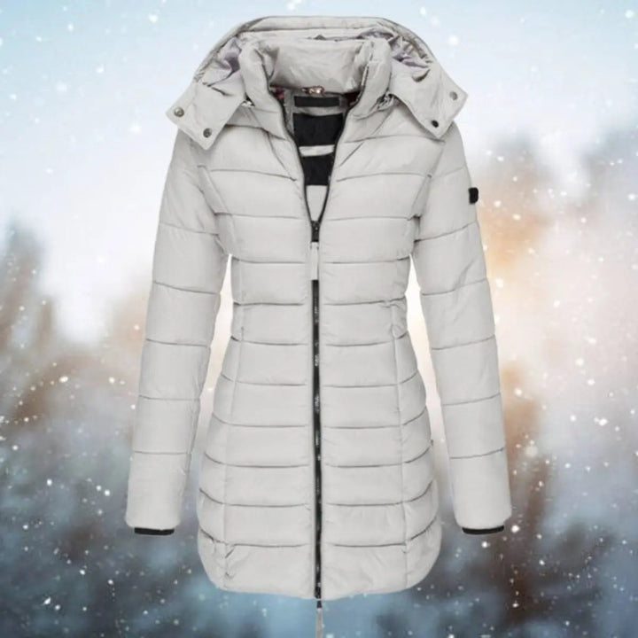 Black women's longline hooded puffer jacket, quilted for warmth, stylish winter coat & outdoor outerwear.