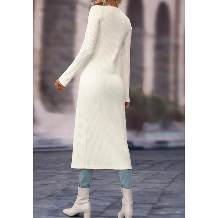 Modern women's longline V-neck jacket, a lightweight and comfortable buttoned top for versatile styling.