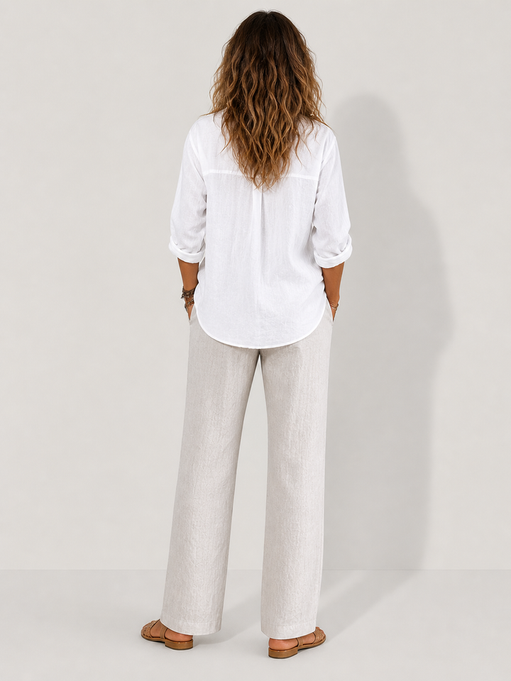 Stylish wide-sleeve women's summer top. Loose fit casual shirt for versatile everyday wear.