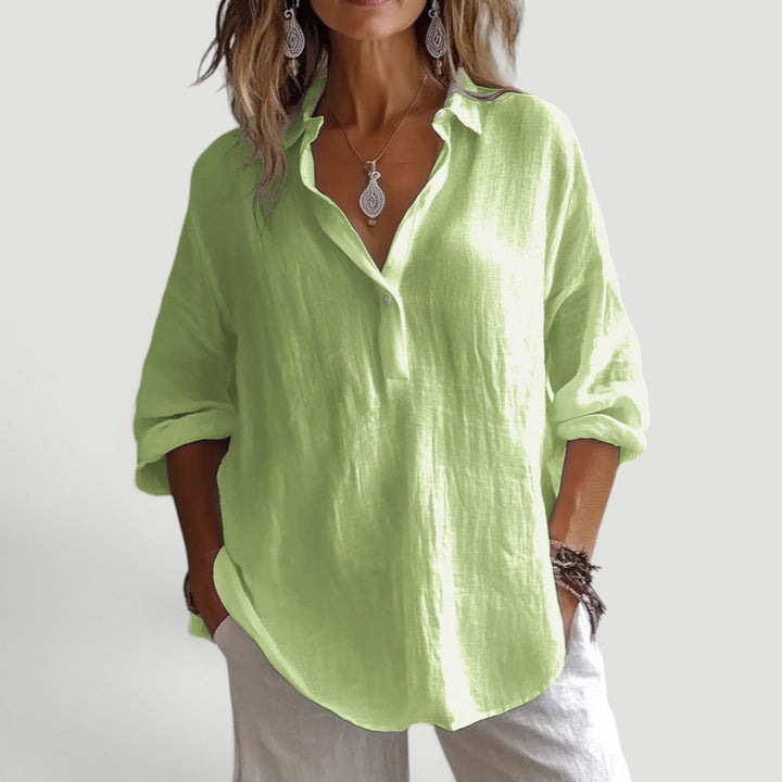Chic wide-sleeve women's loose fit blouse. A button-up casual shirt perfect for summer.