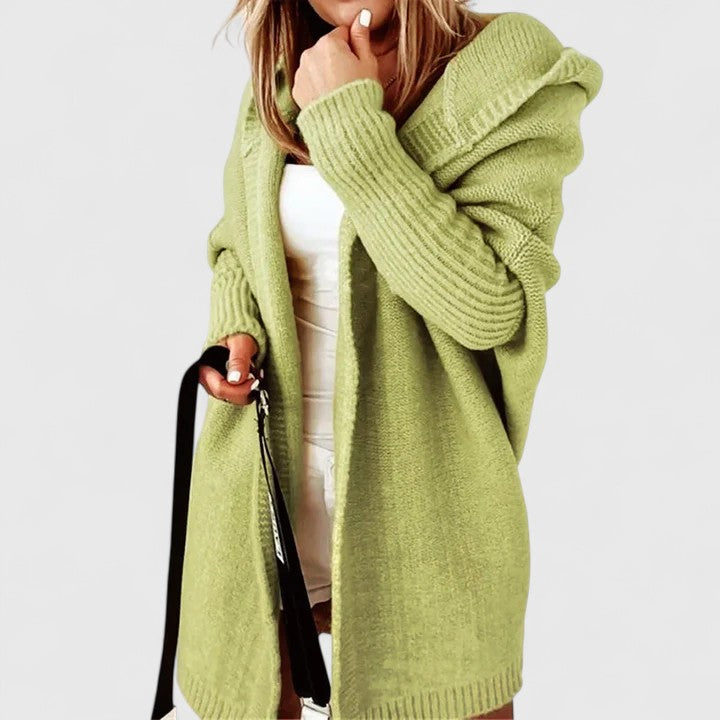 Effortless women's loose fit hooded cardigan, an oversized and stylish layering piece for casual fashion.