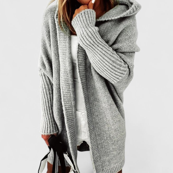 Women's knee-length loose fit hooded cardigan, comfortable & stylish, perfect for fall and winter outerwear.