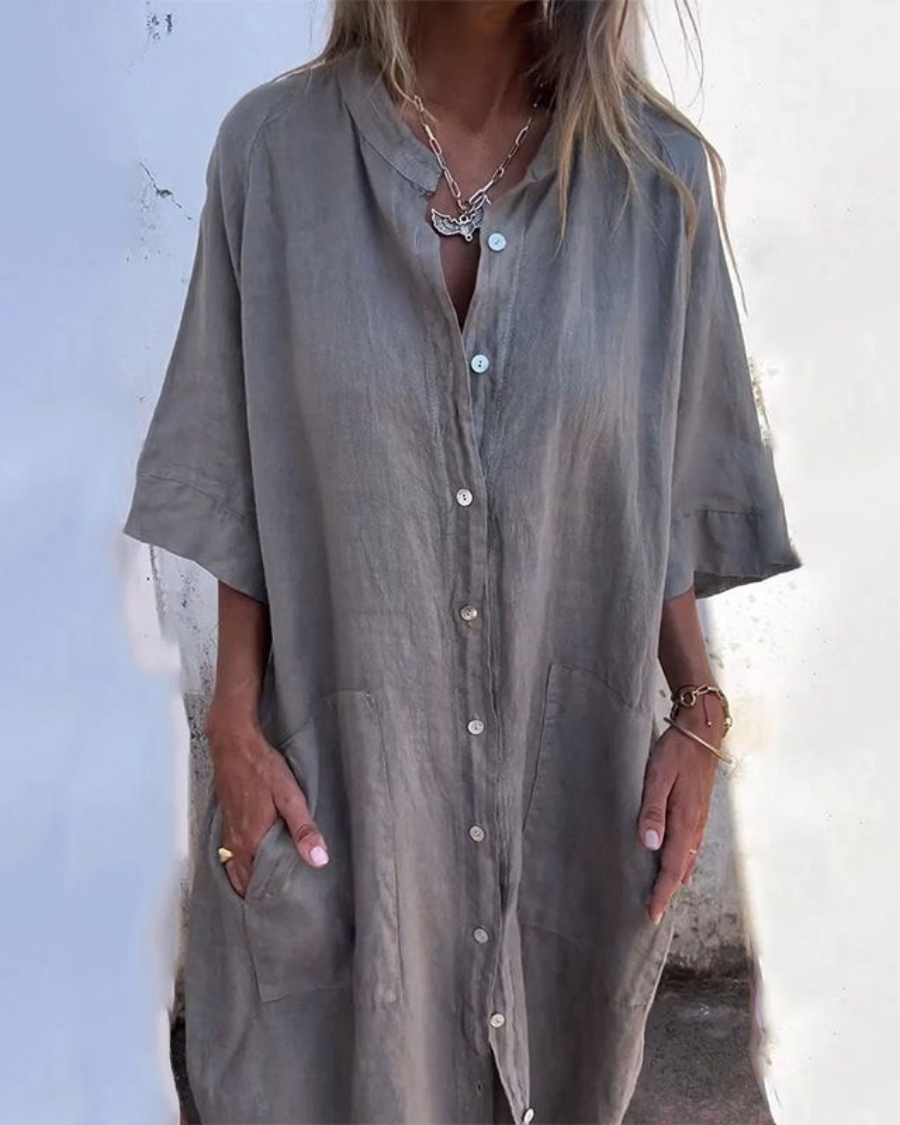 Women's loose fit midi shirt dress in a chic color, featuring a button front, practical pockets, and a comfortable design.