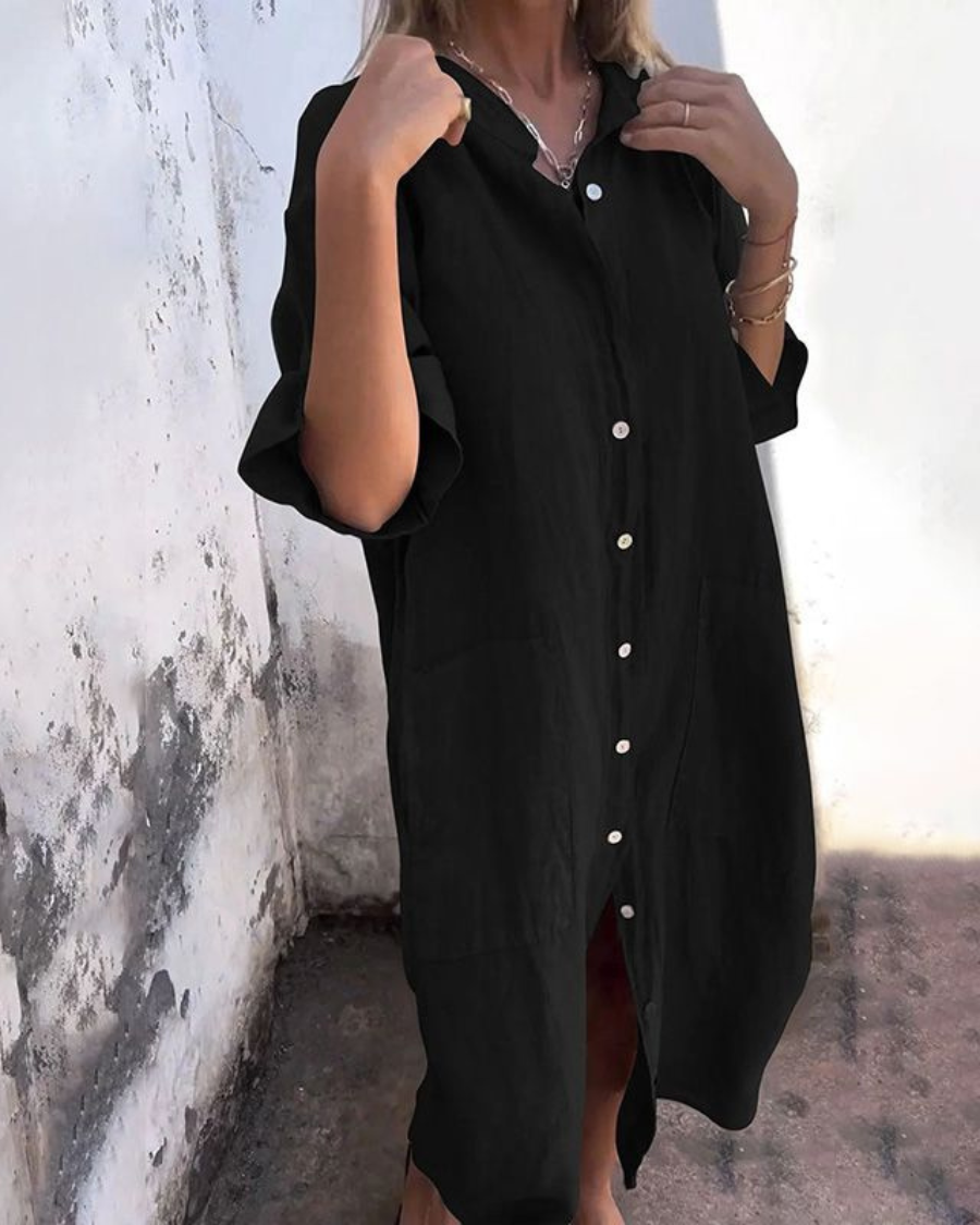 Casual women's midi shirt dress with a relaxed fit and handy pockets, perfect for comfortable everyday wear and summer style.