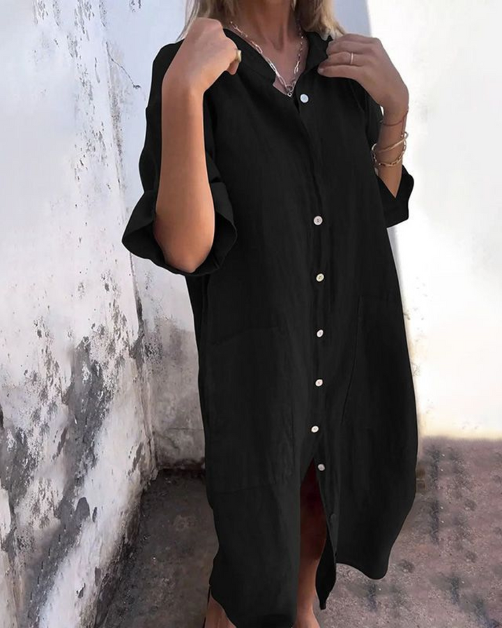 Casual women's midi shirt dress with a relaxed fit and handy pockets, perfect for comfortable everyday wear and summer style.