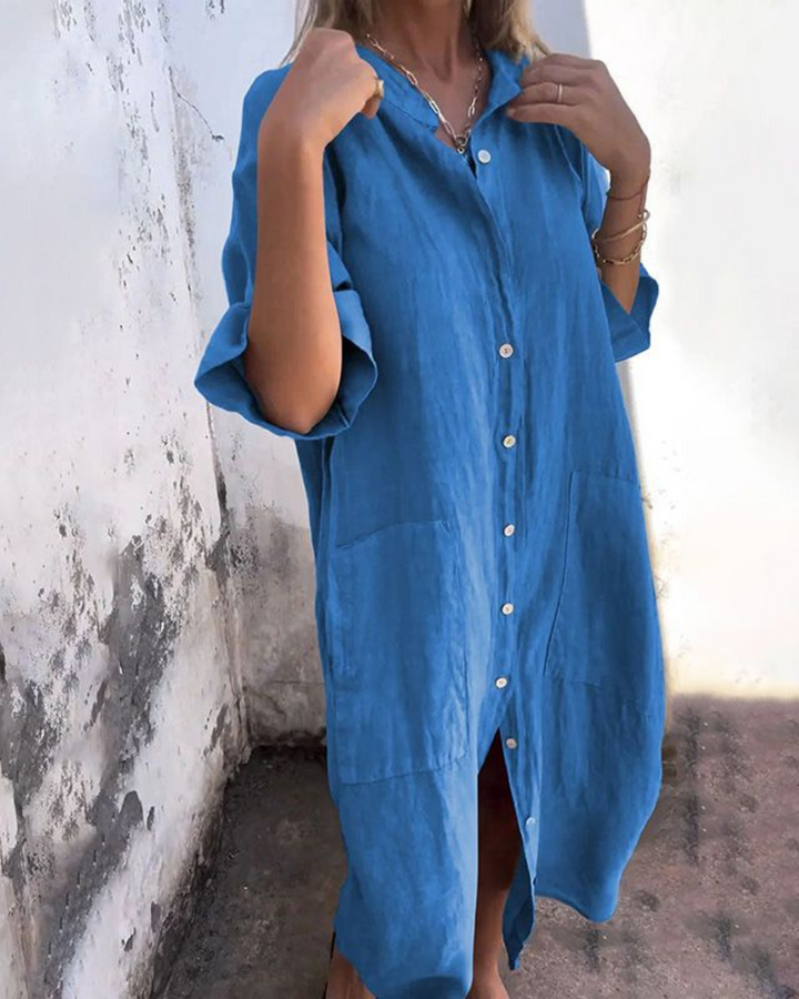 Stylish women's midi shirt dress with functional button front and convenient pockets, offering a versatile and timeless look.