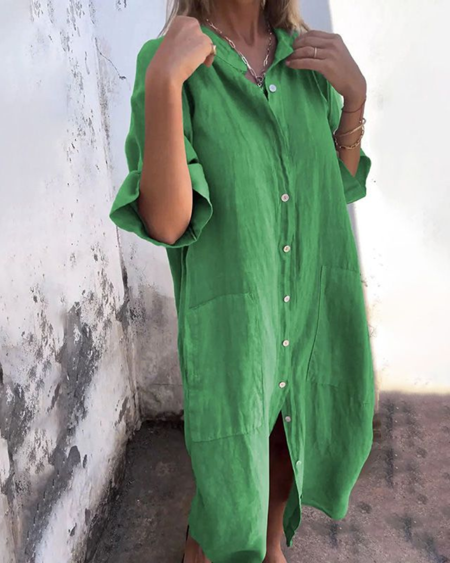 Comfortable loose fit midi shirt dress for women, designed for easy wear with a flattering silhouette and practical pockets.