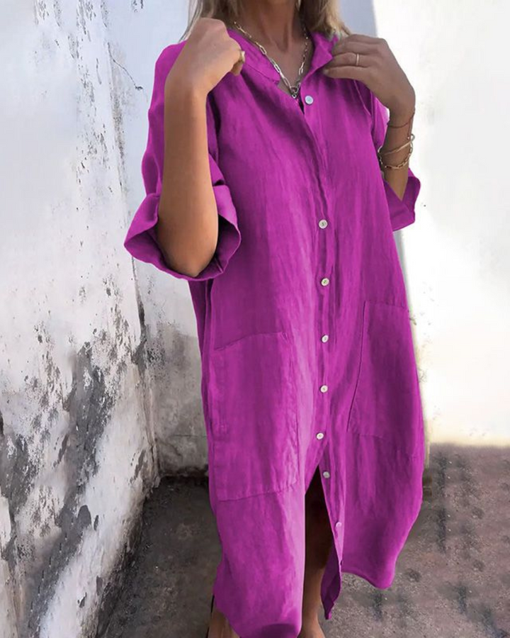 Chic and versatile women's midi shirt dress with a loose fit and pockets, ideal for various casual or everyday occasions.