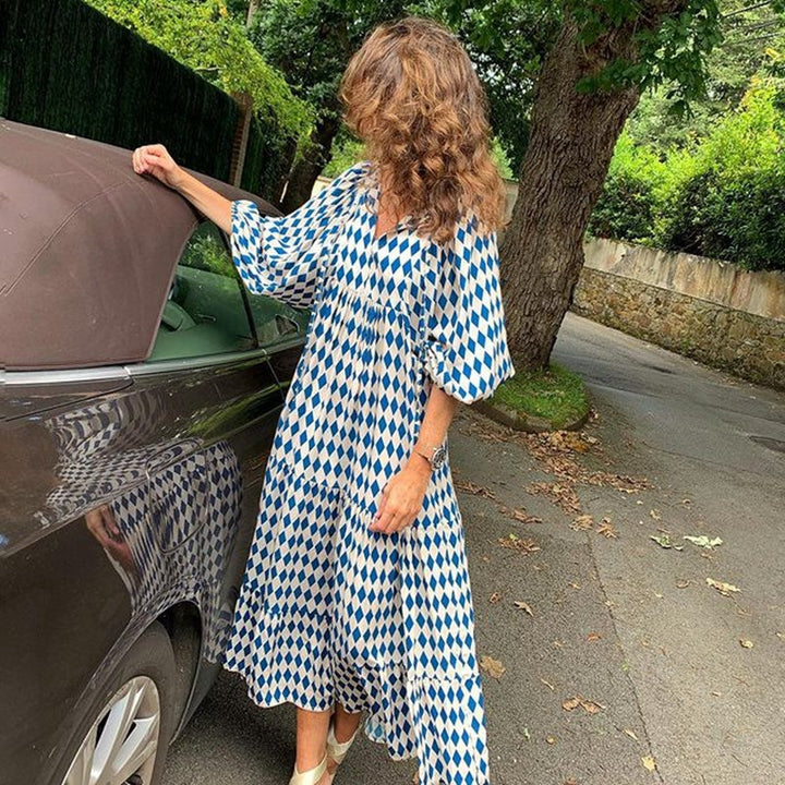 Loose fit women's everyday dress with a comfortable, flowy design, three-quarter sleeves, and vibrant print.