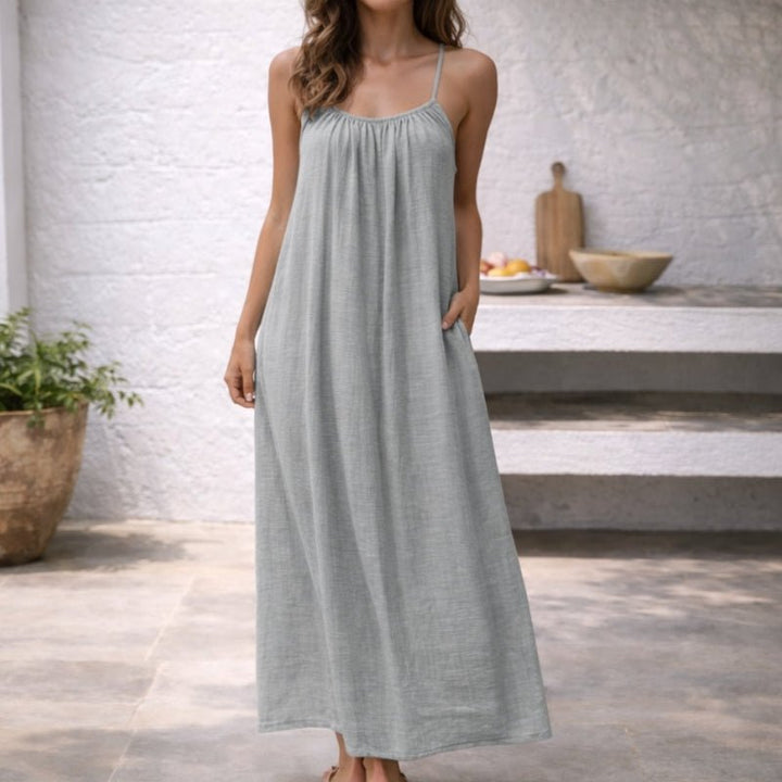 Relaxed fit women's spaghetti strap maxi dress with pockets. Your go-to comfortable and stylish summer vacation dress.
