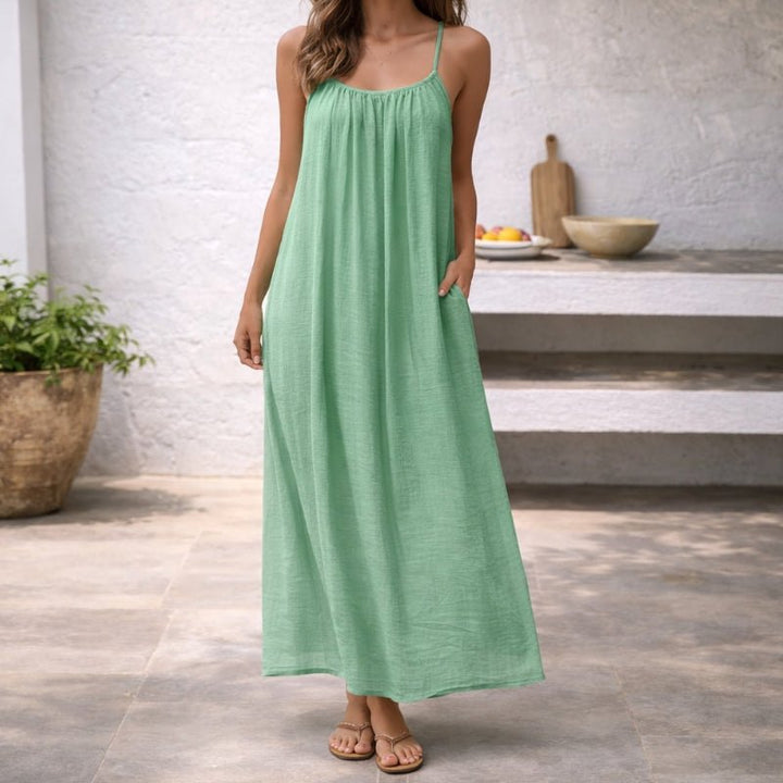 Soft, comfortable women's loose-fit spaghetti strap maxi dress with pockets for summer.