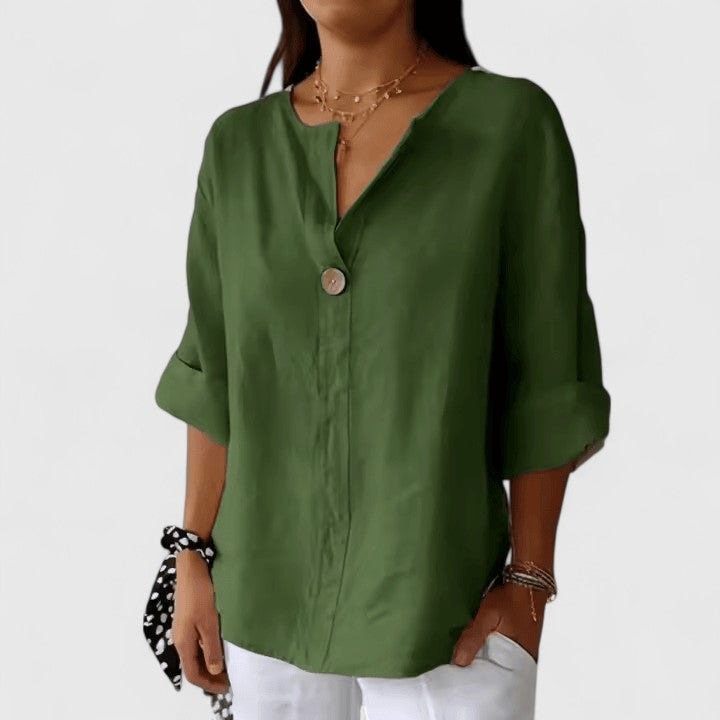 Relaxed fit women's V-neck blouse featuring a trendy front knot. Comfortable & elegant for summer & everyday.
