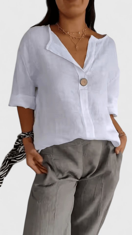 Elegant women's blouse: V-neck, loose fit, & unique front knot detail. Ideal for casual or dressy looks.
