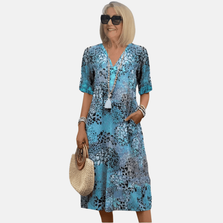 Comfortable women's knee-length V-neck summer casual dress. Stylish 3D print makes it ideal for vacations & daily wear.