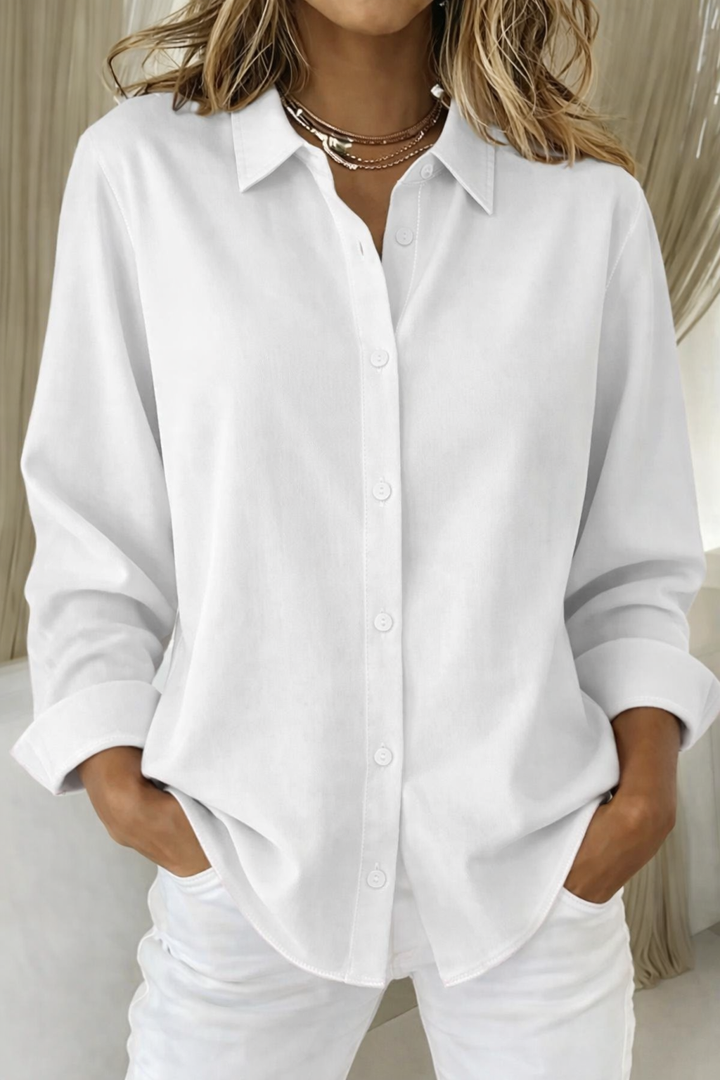 Versatile women's button-down blouse with a loose fit, ideal as a casual summer top for any occasion.