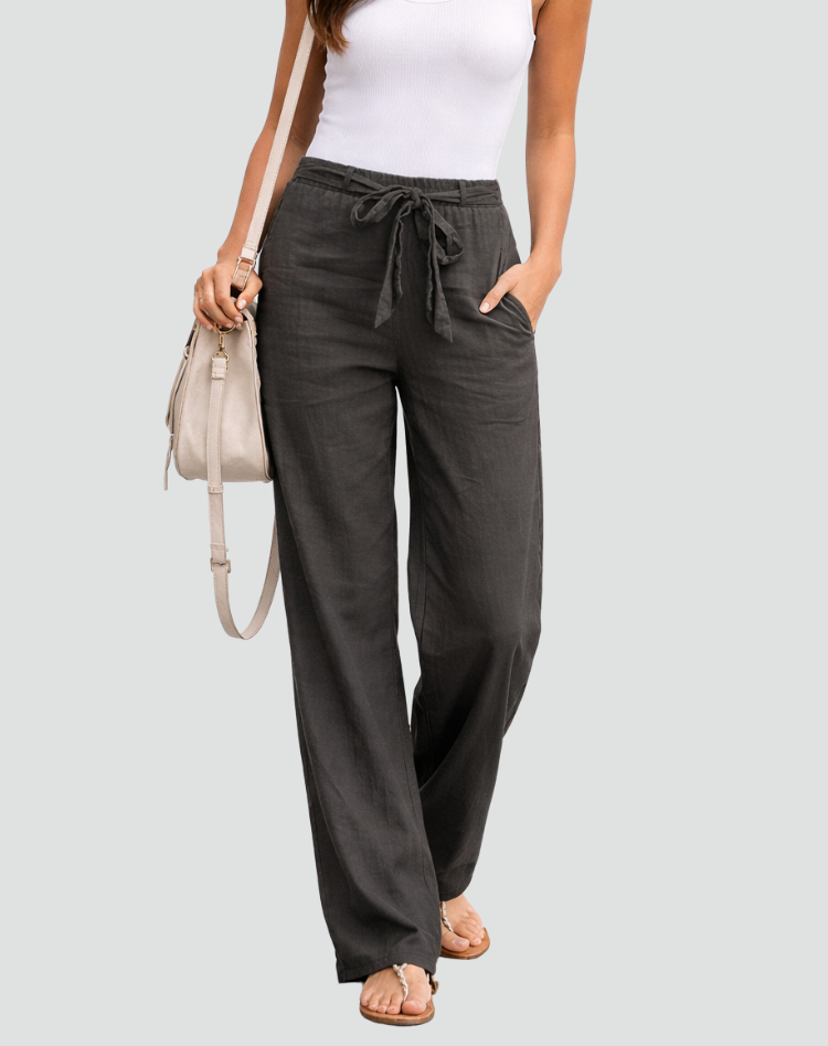 Detailed view of women's loose linen wide leg pants, emphasizing breathable fabric for summer.