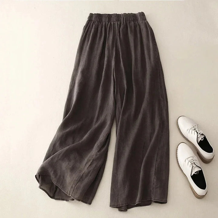 Elegant women's loose fit wide-leg cropped pants with a chic ruched waistband, suitable for versatile summer outfits.