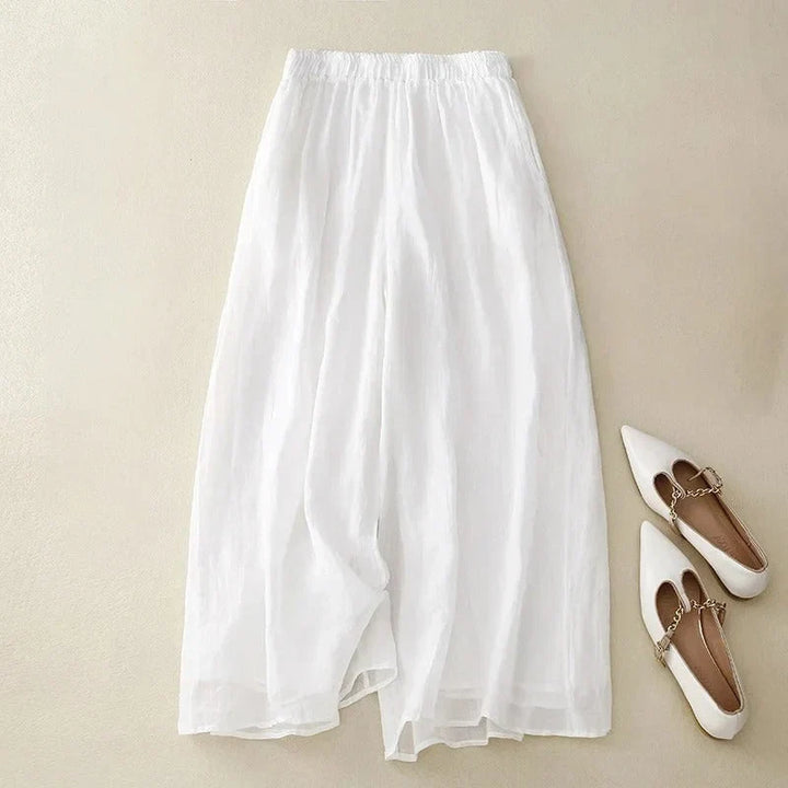Versatile women's cropped wide-leg pants with a comfortable ruched waistband, great for casual elegance & summer fashion.