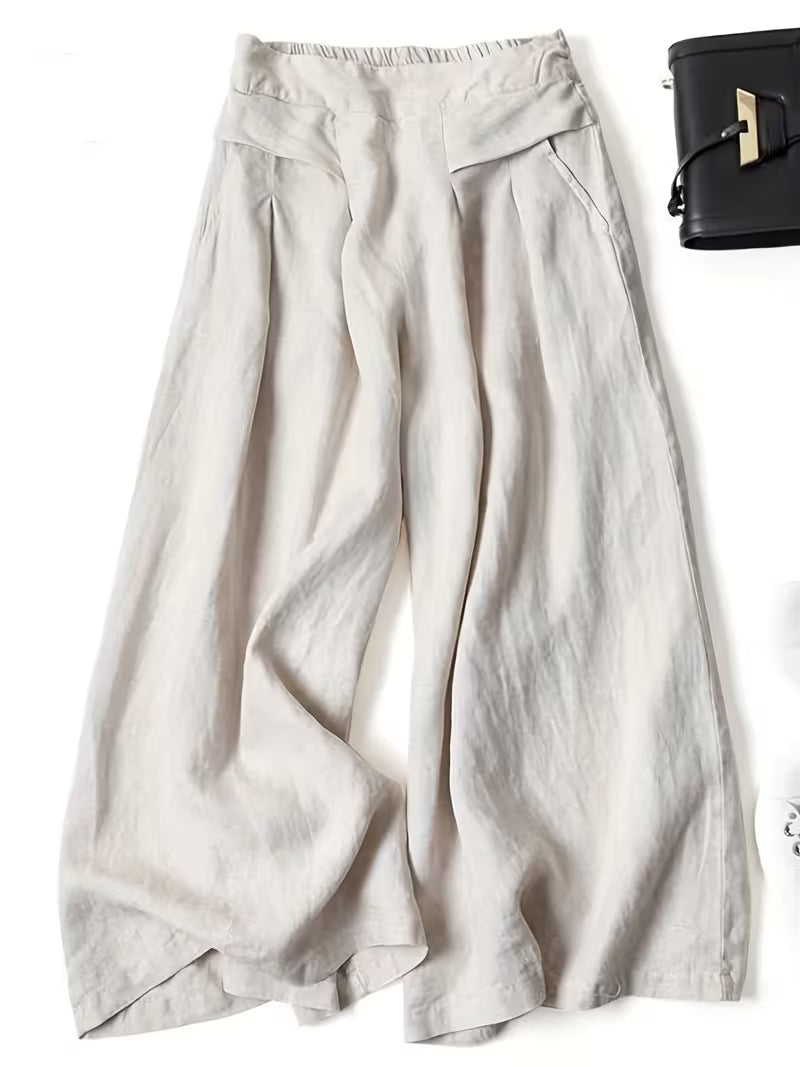 Comfortable women's wide-leg pants with elastic waist. Loose flowy trousers for casual summer wear.