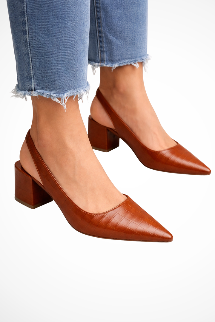 Women's low heel slingback pumps with pointed toe. Elegant and chic for work or fashion.