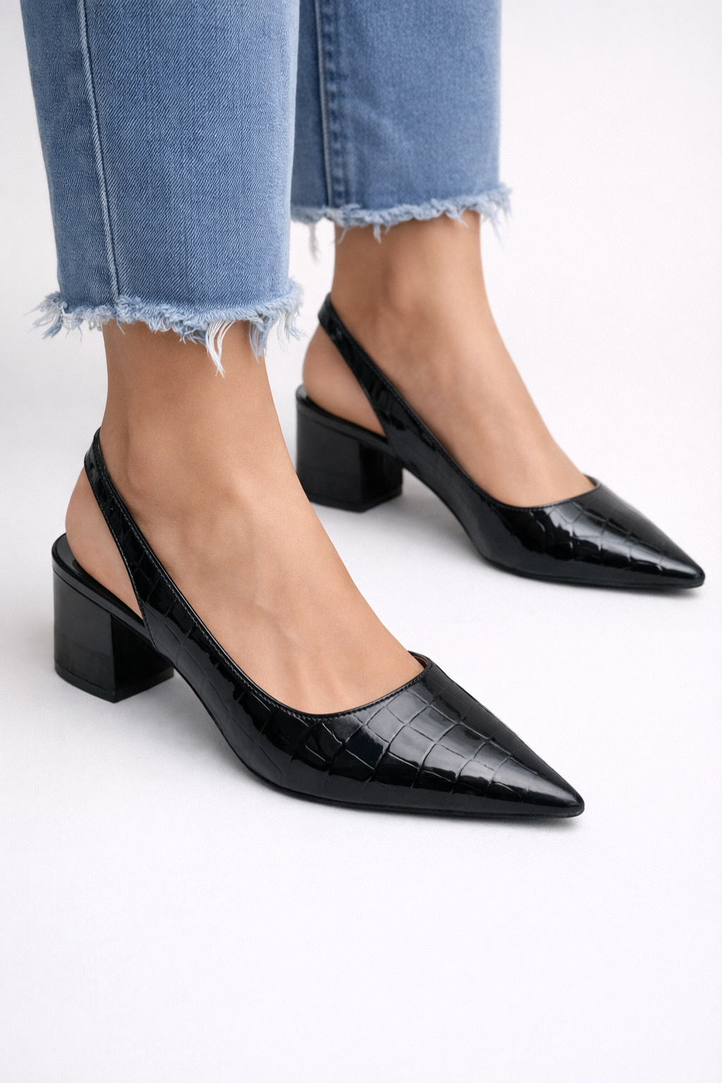 Comfortable low heel slingback pumps for women. Versatile pointed toe design, perfect for workwear.