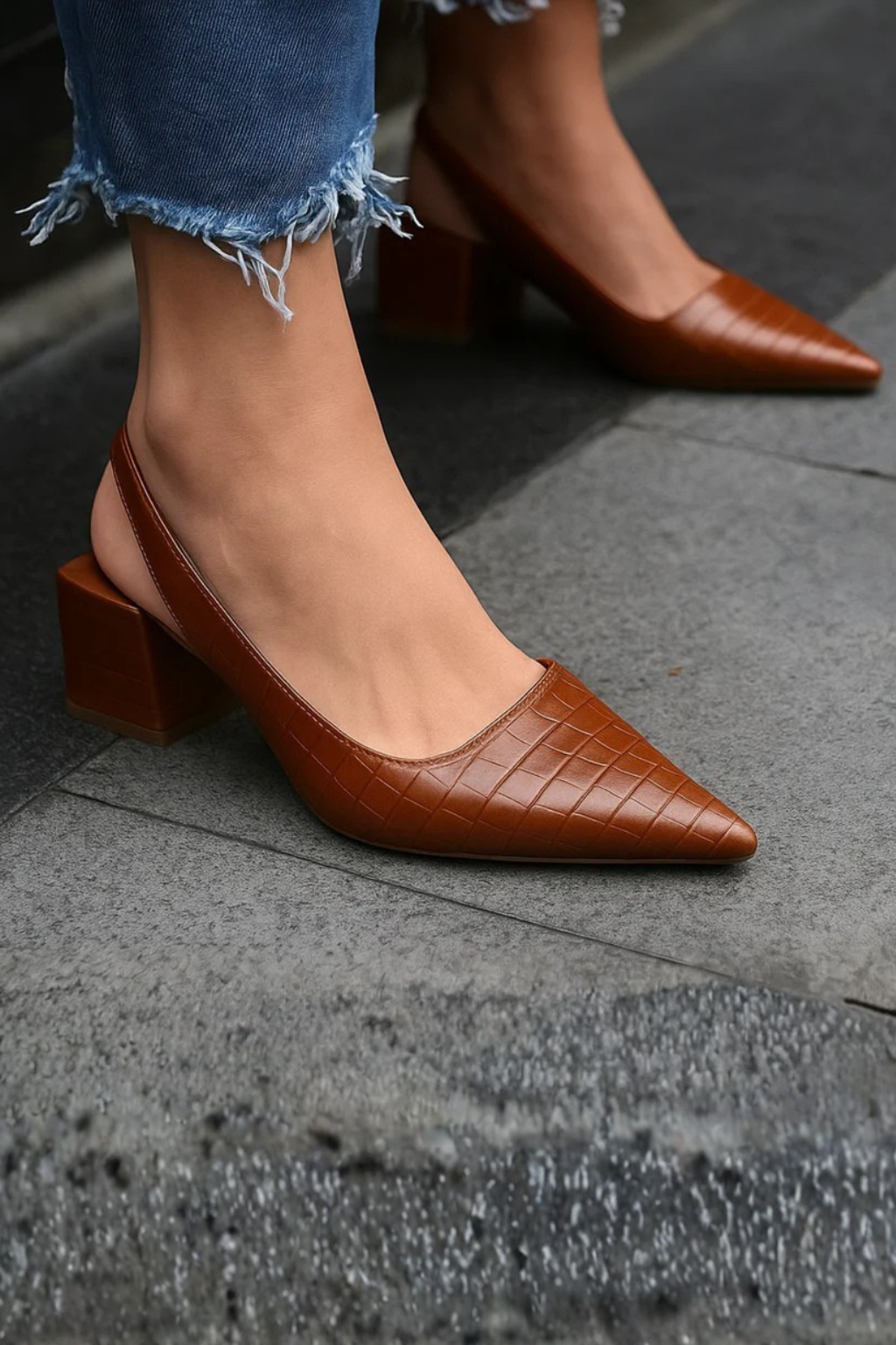 Fashionable women's low heel slingback pumps with a sleek pointed toe. Comfortable & versatile for daily wear.