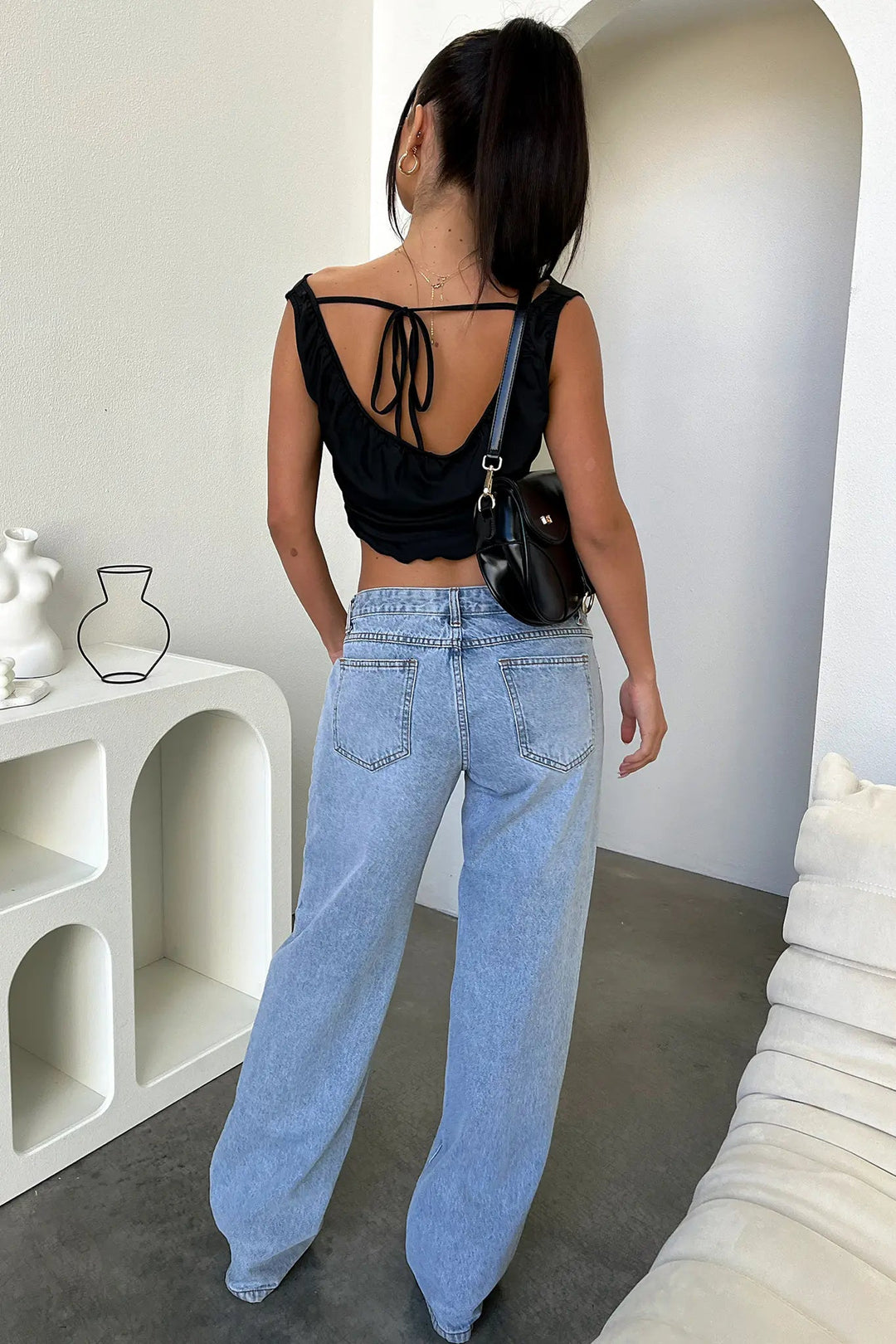 Women's retro low-rise baggy straight-leg jeans. Light blue wash, relaxed fit for streetwear or casual outfits.