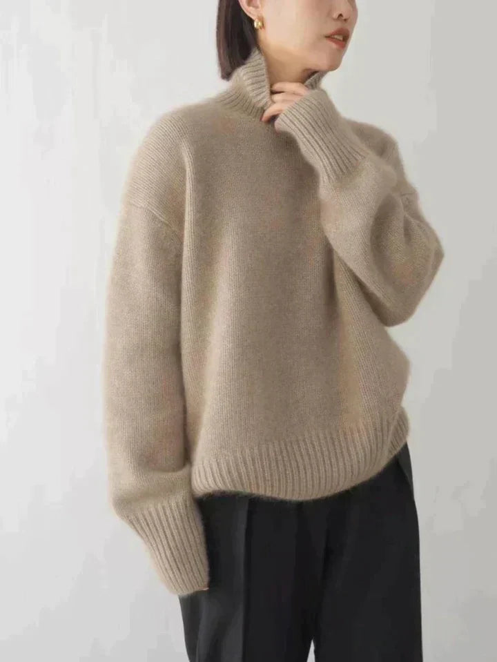 Women's luxe knit turtleneck sweater in a classic style, offering elegant comfort for fall & winter fashion.