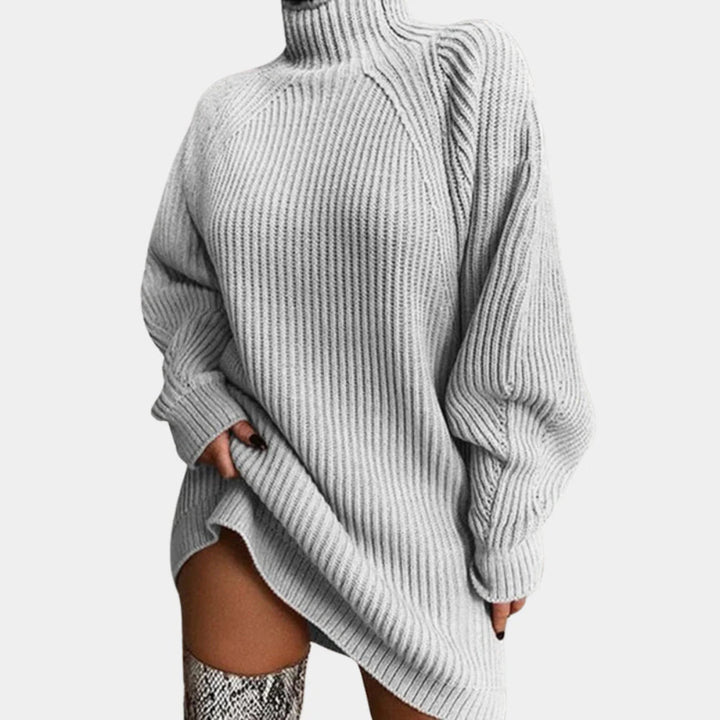 Close-up of a women's cozy luxe knit turtleneck sweater, highlighting its soft texture & comfortable fall wear.