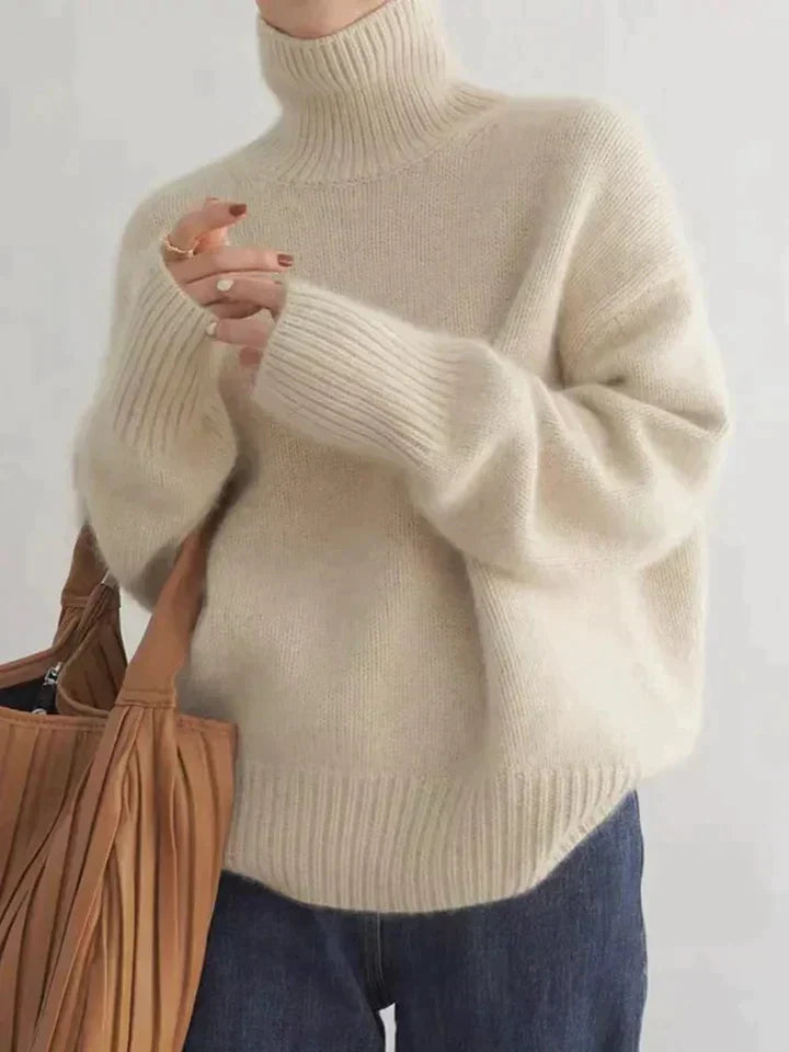 Back view of a women's comfortable luxe turtleneck sweater, showcasing its classic style and elegant fit.