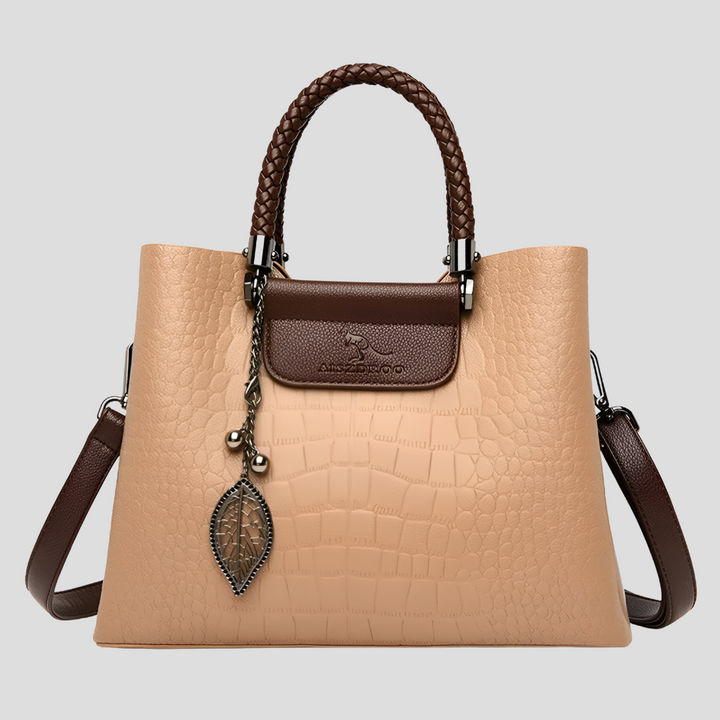 Reddish-brown Teak leather handbag. Elegant women's luxury shoulder bag, combining fashion & practicality.