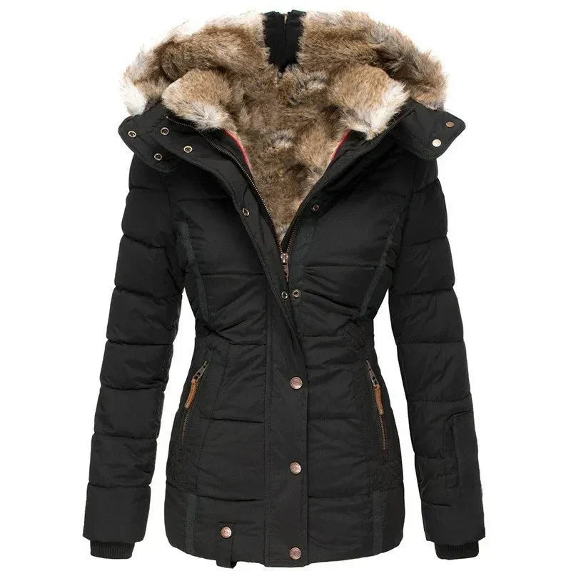 Women's luxury quilted puffer jacket with stylish faux fur hood for winter warmth.