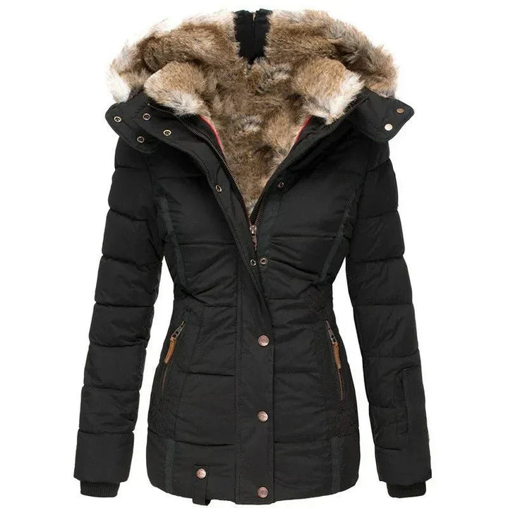 Women's luxury quilted puffer jacket with stylish faux fur hood for winter warmth.