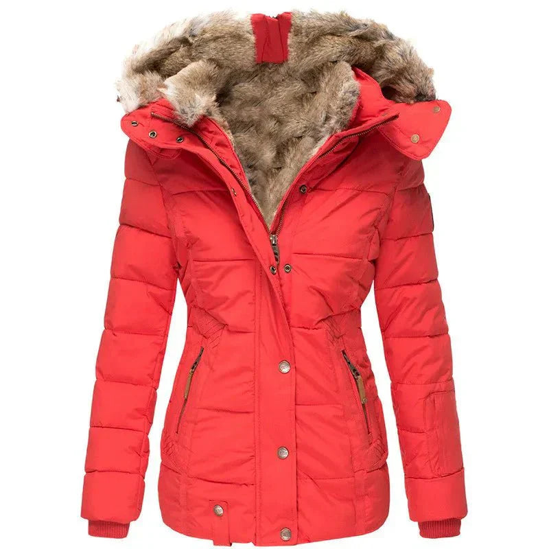 Stylish women's cold weather outerwear: a quilted puffer jacket with faux fur hood.