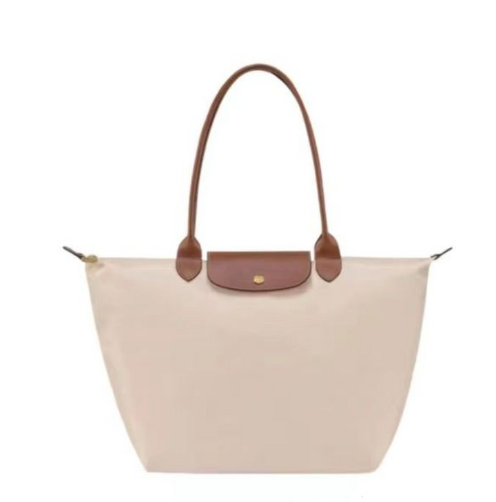 Women's stylish shoulder handbag with a secure top zip, spacious interior, perfect luxury accessory for any outfit.